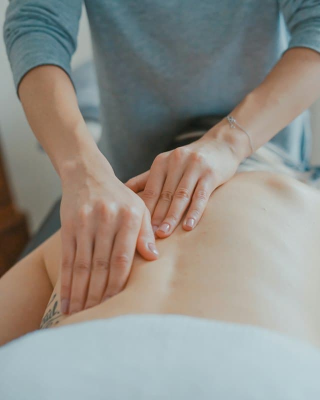 Massage therapist working on a client's back